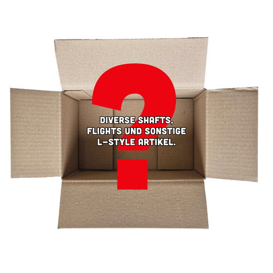 McDart Mystery Box - L-stijl Das Bild zeigt einen offenen Karton mit einem großen roten Fragezeichen darin. In der Mitte steht der Text: "Diverse Shafts, Flights und sonstige L-Style Artikel."
