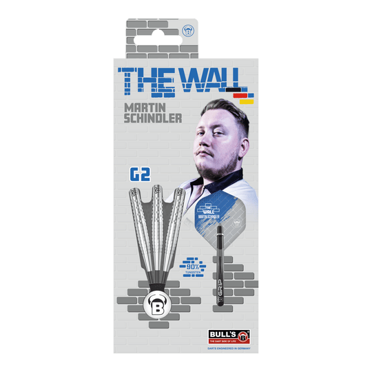 Bulls Martin Schindler Original Generation 2 steel darts Die Verpackung zeigt die "Bulls Martin Schindler Original Generation 2 Steeldarts" mit dem Bild von Martin Schindler. Auf der Vorderseite sind drei Darts und die Aufschrift "THE WALL" sowie "90% Tungsten" abgebildet.