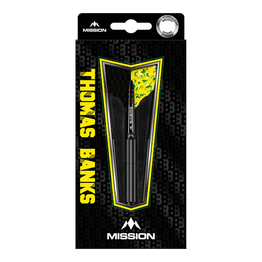 Die Abbildung zeigt das Produkt "Mission Thomas Banks Black PVD Steeldarts - 24g" in seiner Verpackung. Die Verpackung ist überwiegend schwarz mit gelben Akzenten und dem Namen "Thomas Banks" deutlich sichtbar.