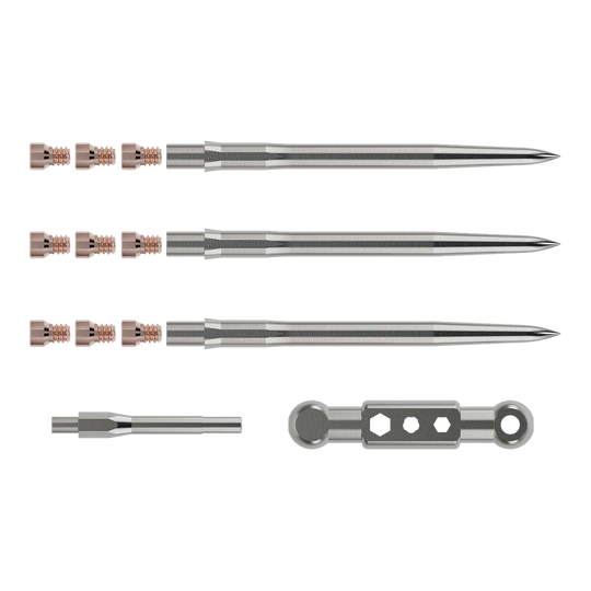 Caliburn Starterkit Das Bild zeigt das Caliburn Starter-Kit mit mehreren metallischen Komponenten. Zu sehen sind lange, spitze Stäbe, kleine Schrauben sowie zwei weitere Werkzeugteile.